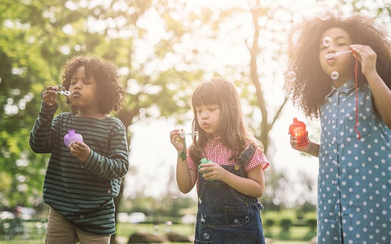 Kids playing with bubbles during school break